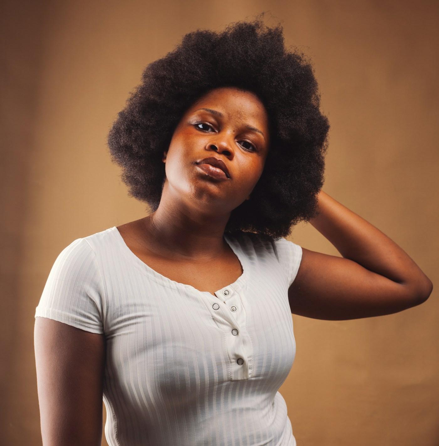 Portrait of a woman wearing her natural afro